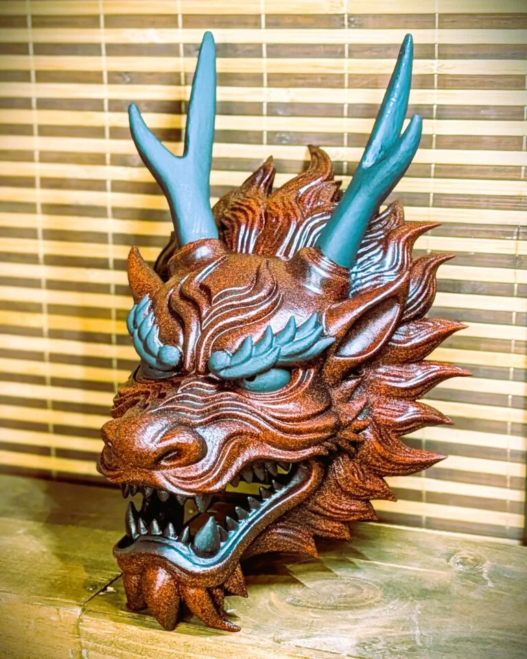 Red Japanese dragon mask with painted relief details