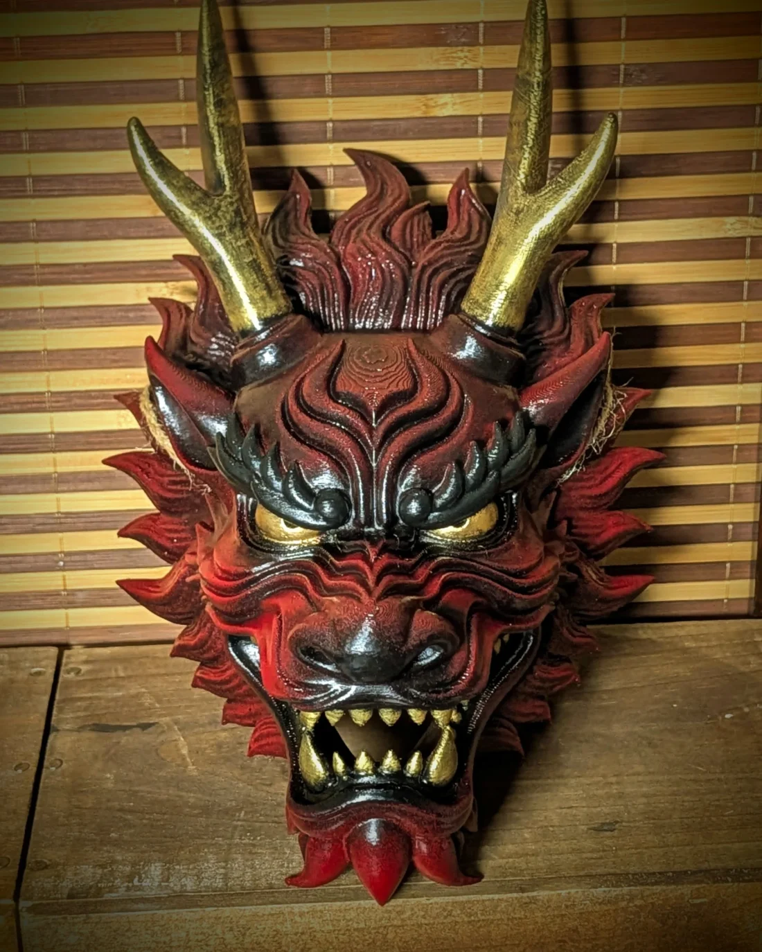 Red and black Japanese Ryū Dragon mask, front view