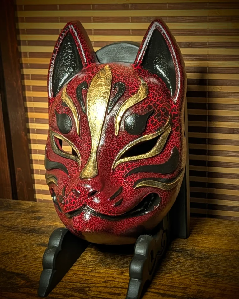 Handmade cracked red Modern Kitsune mask by Dai Yokai, three-quarter view